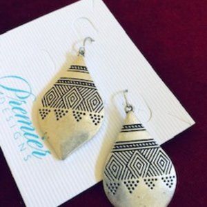 Pattern silver drop earrings.